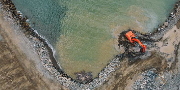 Excavator at a secondary mineral resource site